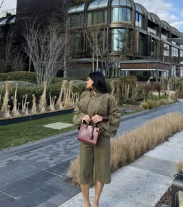 Street style olive green suede loungewear set featuring long sleeve top and bermuda shorts