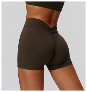 Detailed back view of high waist scrunch butt yoga shorts in dark brown stretch fabric