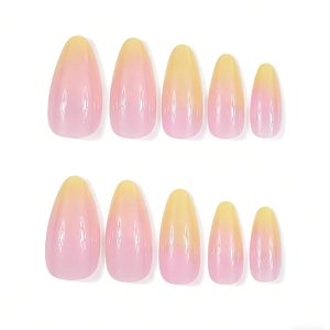Detail view of almond press-on nails with pink to yellow ombre gradient and glossy finish