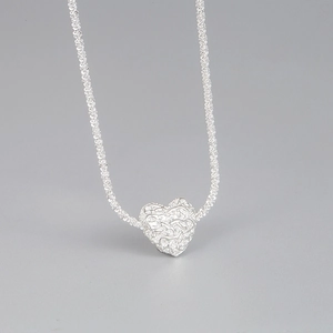S925 sterling silver necklace with textured lava heart pendant on bold braided chain