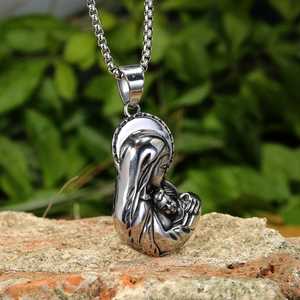 Silver religious pendant necklace featuring a detailed Mother and Child relief on a metal chain