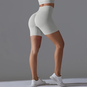Detail view of seamless white high-waisted yoga shorts with butt-lifting stitching