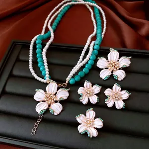 Vintage floral jewelry set with multi-layer pearl necklace and white enamel earrings