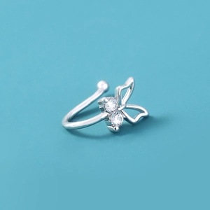 Close-up of silver butterfly nose clip with hollow wings and clear zircon stone accents