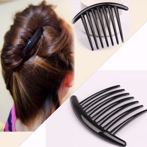 Detail view of black seven-tooth hair side comb with side-by-side wearing effect