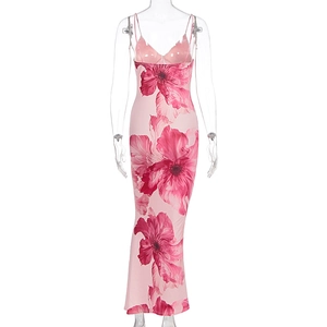 Detail of summer bodycon dress with red floral print and thin spaghetti straps
