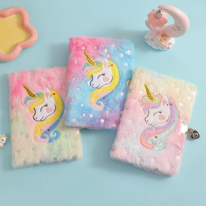 Detail of plush unicorn journals featuring rainbow gradients and heart-shaped metal locks