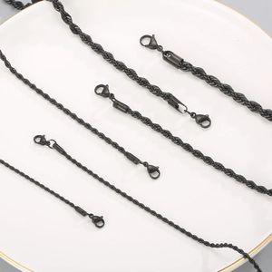 Detail showing various thicknesses of black stainless steel twisted rope chains with lobster clasps
