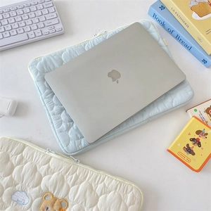 Detailed cloud quilted patterns and cute bear embroidery on a soft tablet sleeve case
