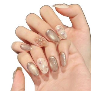 Short cat-eye press-on nails with 3D floral accents and champagne gold magnetic finish