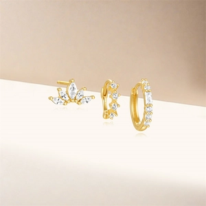 Detail view of S925 sterling silver gold earring set with fan-shaped and hoop cubic zirconia