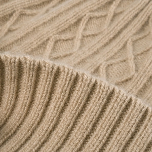 Thick merino wool knit beanie featuring classic cable stitch pattern and ribbed cuff
