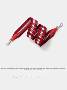 Macro detail of red wave pattern woven strap with 5cm width and leather ends