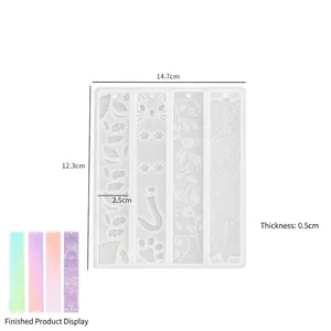 Detail view of bookmark resin mold with cat paw and floral patterns and size markings