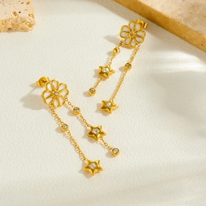 French vintage gold earrings with white flower studs and tassel star dangles