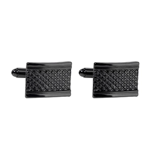 Macro detail of men's square black cufflinks with engraved grid texture and polished metal