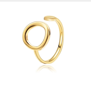 Close-up of 18K gold plated twisted ring with circular detail on white background