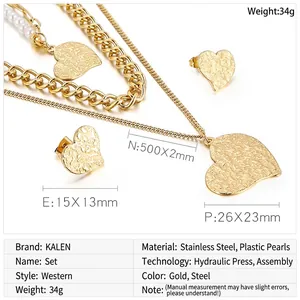 Detailed view of layered gold heart necklace and earring set with size dimensions
