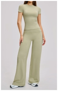 Detail of high-waist wide-leg pants and short sleeve top in olive green brushed yoga set