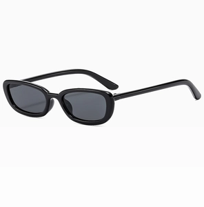 Detailed side view of glossy black oval sunglasses with dark grey lenses and metal hinges