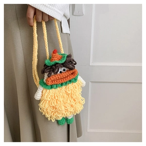 Handmade knitted crossbody bag with a funny cartoon face and bright yellow yarn texture