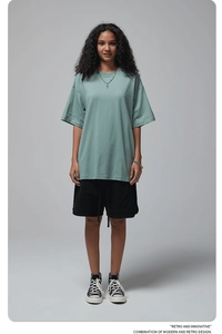 Detailed full body shot of a sage green oversize cotton t-shirt with drop shoulders