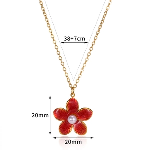 Golden stainless steel necklace featuring red enamel flower and white pearl pendant