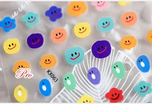 Macro detail of KX063 colorful smiley face nail art stickers with clear adhesive texture