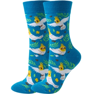 Detailed knit pattern of blue crew socks featuring cockatiel parrots and leaf motifs