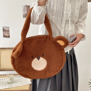 Close-up of brown teddy bear shaped plush tote bag in soft fleece with cute ears