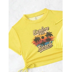 Detail of yellow crop top with Explore the Beach print and side adjustable drawstrings