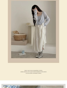 Detail of light blue knit top paired with a white layered tiered skirt for women