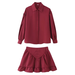 Two-piece burgundy long sleeve lapel shirt and ruffle mini skirt set in flat lay view