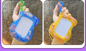 Close-up of mini magnetic drawing board keychains in blue and yellow colors