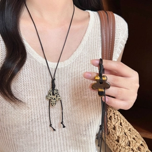Ethnic flower pendant necklace with natural tiger eye and dalmatian jasper on wax cord