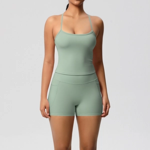 Detail of mint green yoga set featuring high-waist shorts with functional side pockets
