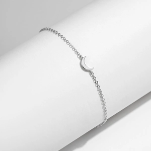 Elegant s925 sterling silver moon pendant bracelet on minimalist white display stand