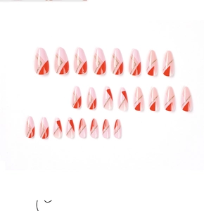 Detailed flat lay of 24 pink and red almond press-on nails with gold geometric lines