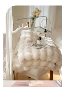 Detail of white faux rabbit fur blanket with luxury 3D bubble texture and soft plush feel