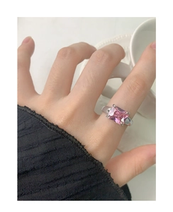 Detail of pink rectangular zircon ring in S925 sterling silver worn on hand