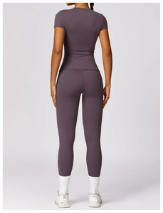 Rear view of tight-fit purple yoga set with high-waist leggings and short-sleeve top
