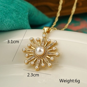 Detailed view of gold sunburst pendant with pearls and dimensions showing 3.1cm height