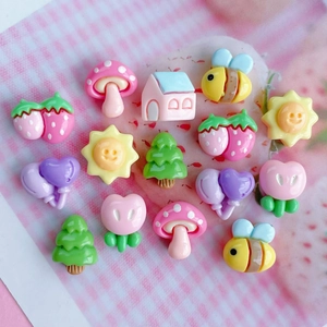 Colorful mini resin charms including mushrooms, bees, and flowers for DIY crafts