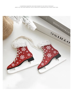 Detail of red wooden ice skate ornaments with snowflake patterns and white faux fur trim