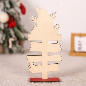 Detailed view of a laser-cut wooden Christmas sign with a deer and pine tree motif