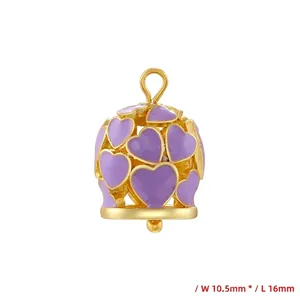 Detailed view of golden heart bell pendant measuring 16mm length and 10.5mm width