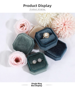 Macro view of octagonal velvet jewelry boxes with soft texture for rings and earrings