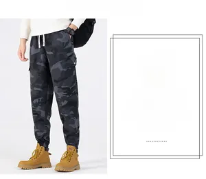 Detail of cargo pants showing camouflage pattern and tactical pockets with drawstring