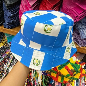 Close-up of blue and white bucket hat with printed Guatemala emblem pattern