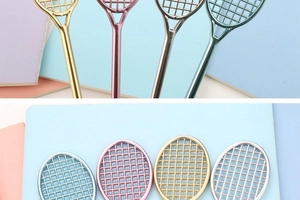 Close-up of badminton racket pens with metallic finish in gold, pink, silver and blue
